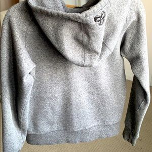 TNA sports wear zip up sweater size Small.